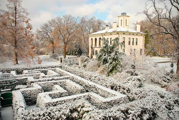 The hedges and borders in the Victorian district are dusted with a gentle winter snow, which highlights the garden's "bones."