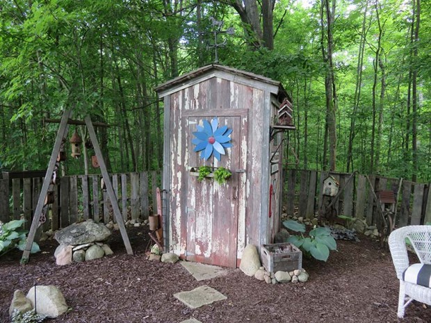 Elaine wanted on outhouse shed, so Roy built one. In the winter, it is a storehouse for the garden’s statuary.