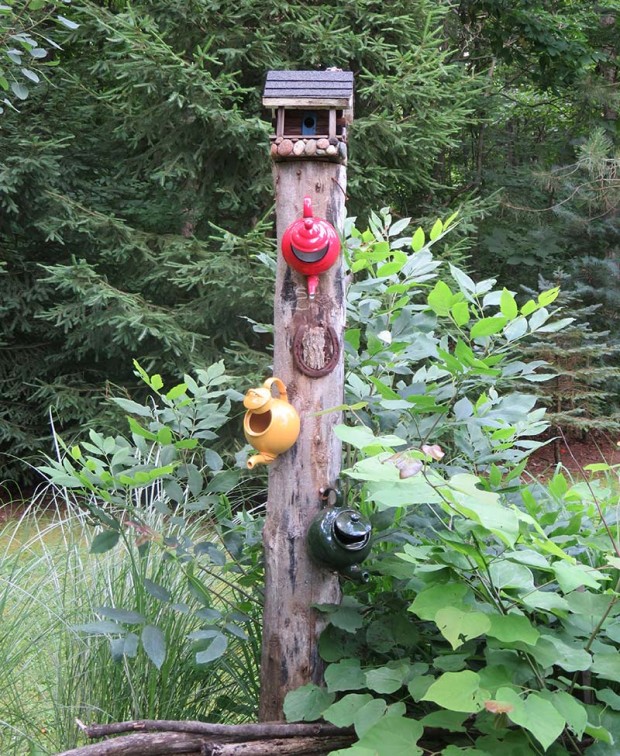 Three teapots have found new lives as birdhouses.