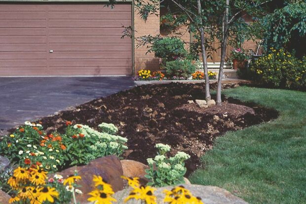 “Pop” the entire garden. If the soil is hard-packed so it pops in clumps, do not break up the clumps. Just spread 2 to 3 inches of compost over the garden.