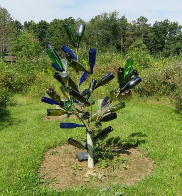A large mowed labyrinth ends at this wine bottle tree.